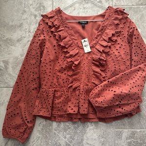 It is a shirt and long sleeves. It is brand new. It is express brand.